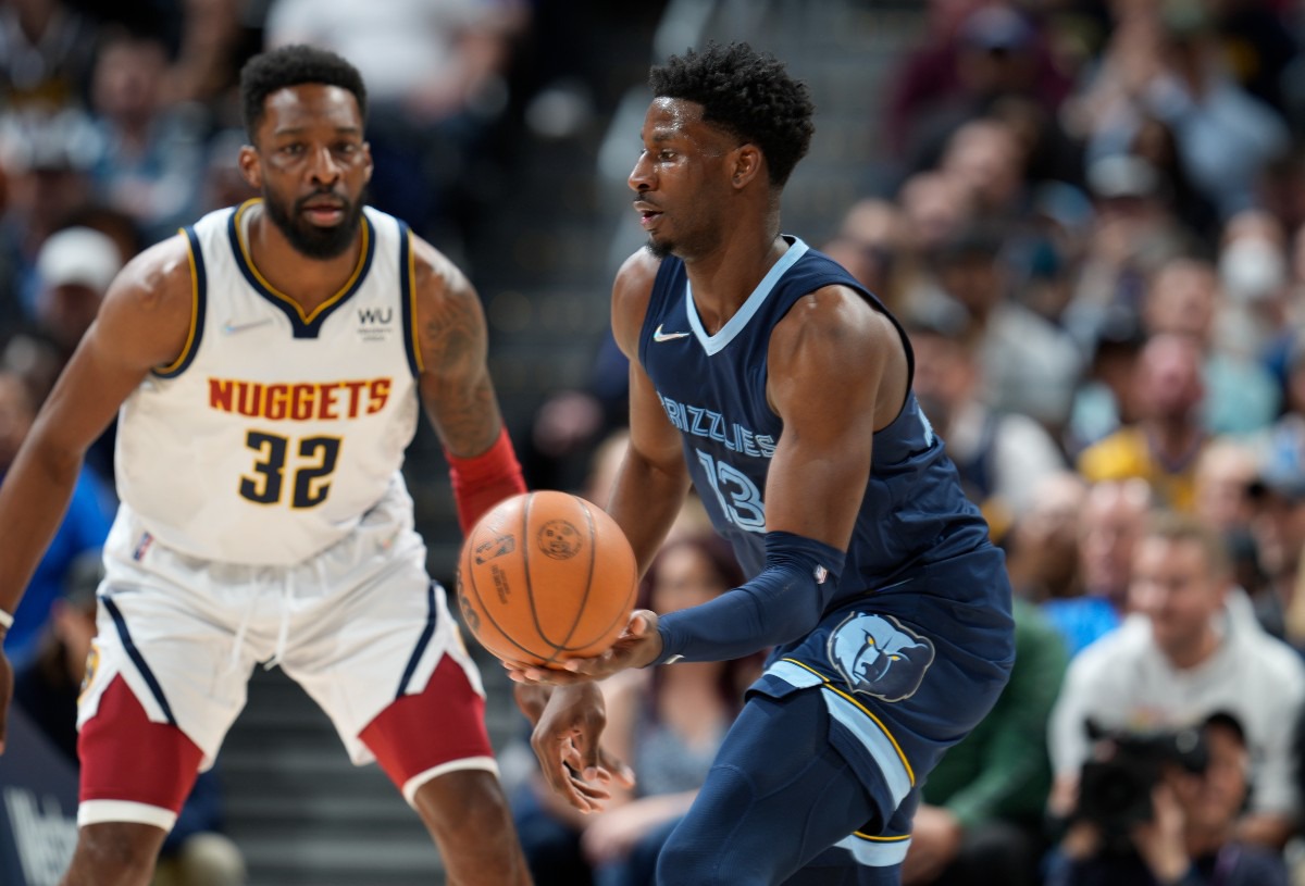 <strong>Memphis Grizzlies forward Jaren Jackson Jr., front, looks to pass against Denver Nuggets forward Jeff Green on April 7, 2022, in Denver.</strong> (David Zalubowski/AP)