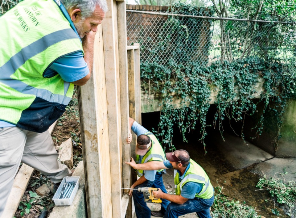 <strong>Germantown Public Works Department makes repairs on a ditch after heavy rains in 2019.</strong> (Houston Cofield/The Daily Memphian file)