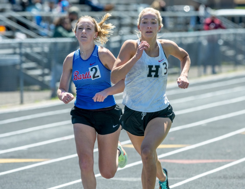<strong>Houston High School's Zoe Marsh finished strong in the 1600 meter against 2nd place Maggie Roy of Bartlett High School at the Houston Track &amp; Field Classic Saturday, April 9, 2022, at Houston High School.</strong> (Greg Campbell/Special to The Daily Memphian)