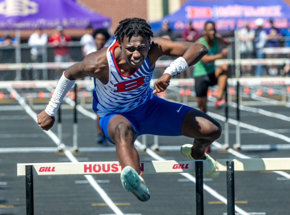 <strong>Bartlett's Kylan Bernard finishes strong in the 300 meter hurdles to win at the Houston Track &amp; Field Classic Saturday, April 9, 2022, at Houston High School.</strong> (Greg Campbell/Special to The Daily Memphian)