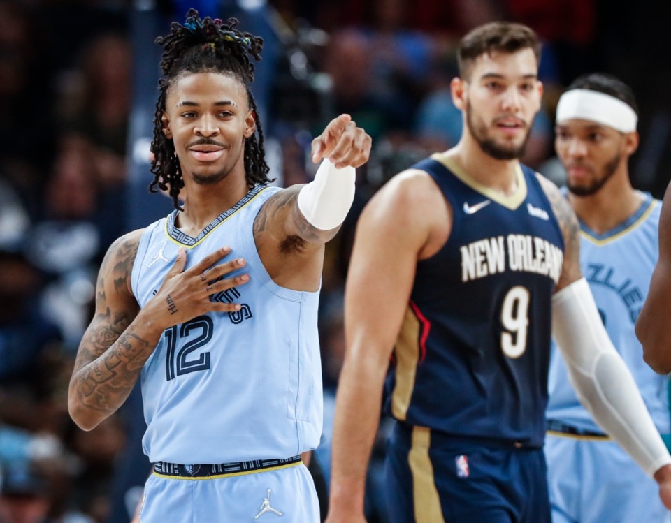 <strong>Memphis Grizzlies guard Ja Morant (left) points to the bench during action against the New Orleans Pelicans during action on Saturday, April 9, 2022.</strong> (Mark Weber/The Daily Memphian)