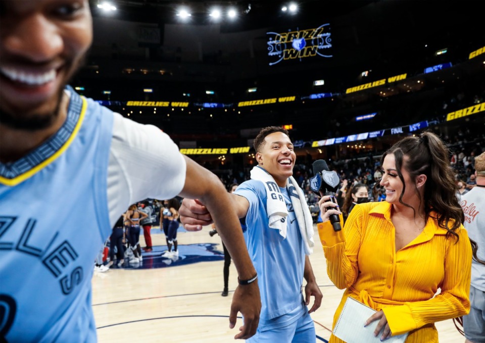 <strong>Memphis Grizzlies guard Desmond Bane (middle) jokes with teammate Ziaire Williams (left) as he does an TV interview after defeating the New Orleans Pelicans on Saturday, April 9, 2022.</strong> (Mark Weber/The Daily Memphian)