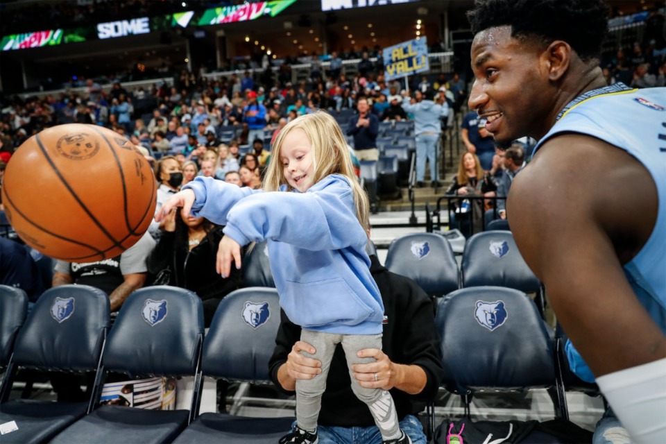 <strong>Memphis Grizzlies fan Vivian Havens, 3, throws the ball onto the court for center Jaren Jackson Jr. before taking on the New Orleans Pelicans at FedExForum. Jackson started this ritual with Vivian before every home game.</strong> (Mark Weber/The Daily Memphian)