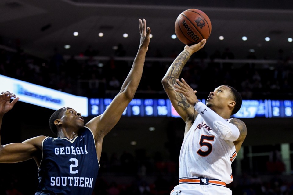 <strong>Georgia Southern guard Elijah McCadden (2) defends against a shot by Auburn guard J'Von McCormick (5) during the second half of an NCAA college basketball game Tuesday, Nov. 5, 2019, in Auburn, Alabama.</strong> (AP Photo/Julie Bennett)