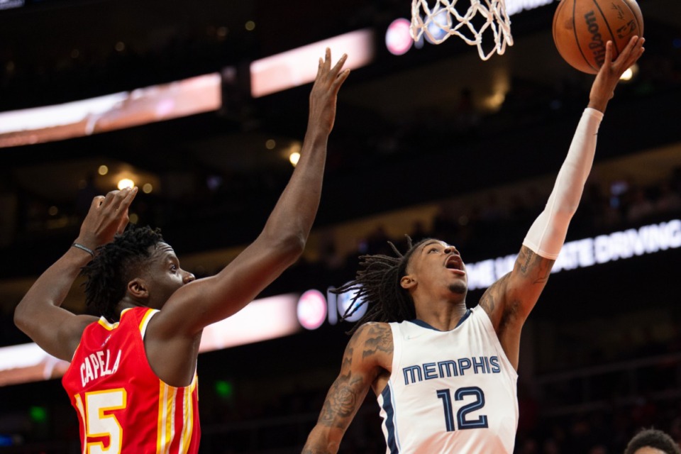 <strong>Memphis guard Ja Morant (12), seen here March 18 against the Hawks, is reason enough to make this season special. But the Grizzlies aren&rsquo;t just a one-man team.</strong> (Hakim Wright Sr./AP file)