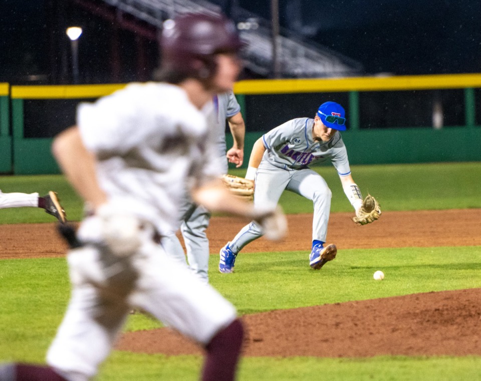 <strong>Bartlett High School third baseman Wyatt Parrish scoops up a ground ball to throw Collierville's Thomas Crabtree out at first on April 12.</strong> (Greg Campbell/Special to The Daily Memphian)