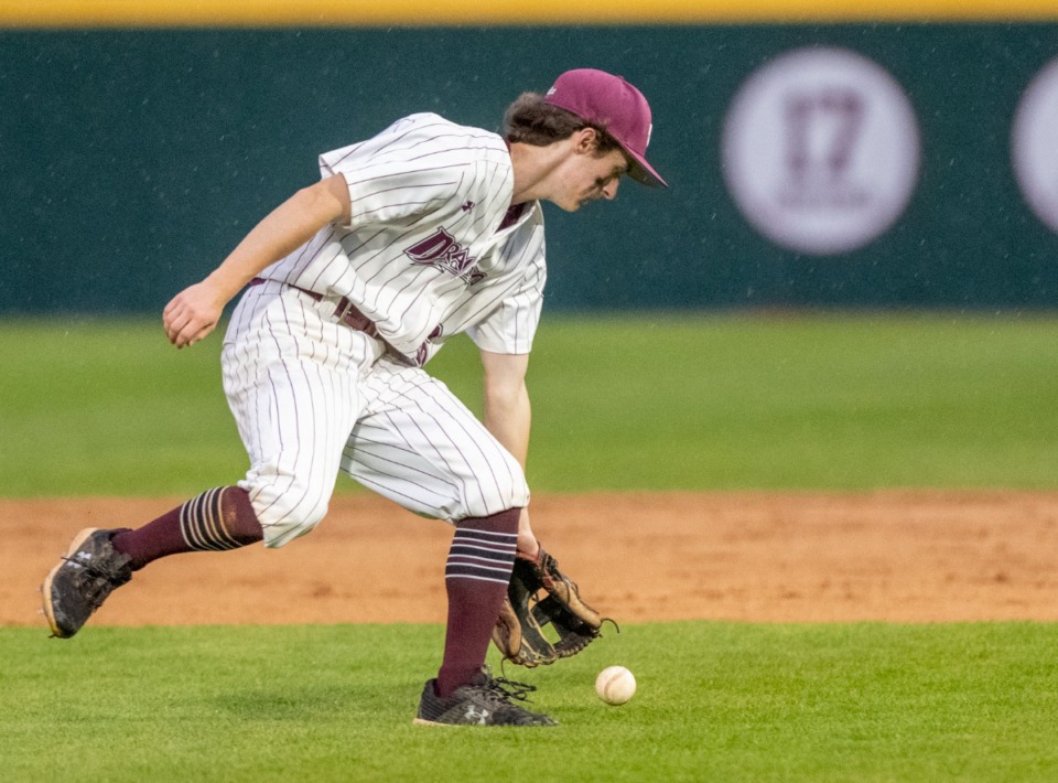 <strong>Collierville second baseman Tyler Hedin grabs an infield ground ball in the rain during the game against Bartlett on April 12.</strong> (Greg Campbell/Special to The Daily Memphian)