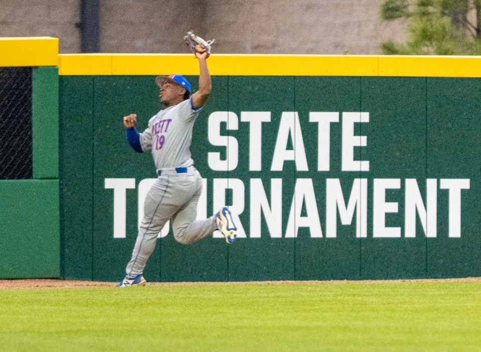 <strong>Bartlett&rsquo;s left fielder Aiden Hackett goes to the wall to catch a fly ball in the game against Collierville on April 12.</strong> (Greg Campbell/Special to The Daily Memphian)