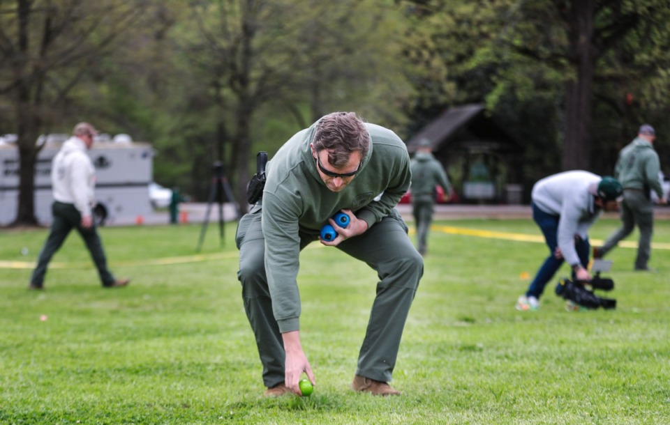 <strong>The Shelby County Sheriff&rsquo;s Department bomb squad hides specially made beeping eggs Friday to help visually impaired children and adults participate in an Easter egg hunt at Overton Park.</strong> (Patrick Lantrip/Daily Memphian)