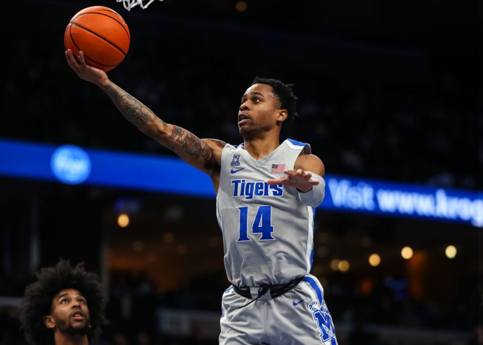 <strong>University of Memphis guard Tyler Harris (14) goes up for a layup during a Feb. 5, 2022 game against UCF.</strong> (Patrick Lantrip/Daily Memphian file)