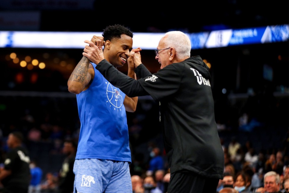 <strong>University of Memphis coach Larry Brown celebrates with Tyler Harris after a huge dunk at Memphis Madness in FedExForum Oct. 13, 2021.</strong> (Patrick Lantrip/Daily Memphian)