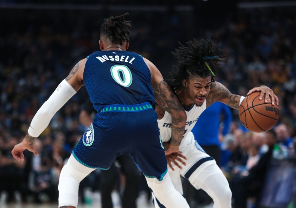 <strong>Memphis Grizzlies guard Ja Morant (12) fights through a screen during the playoff game Saturday against the Minnesota Timberwolves.</strong> (Patrick Lantrip/Daily Memphian)