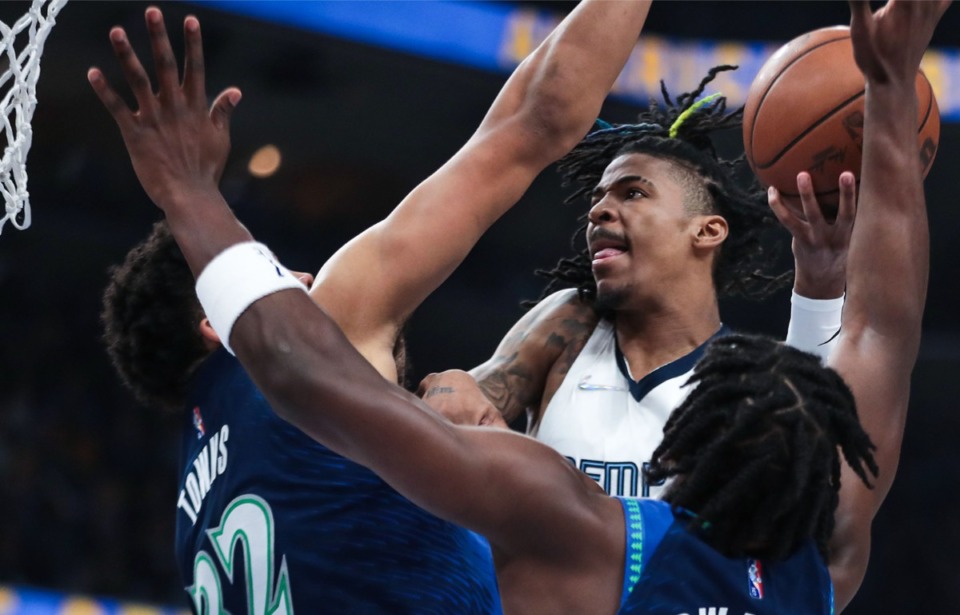 <strong>Memphis Grizzlies guard Ja Morant (12) goes up for a contested layup during the playoff Saturday game against the Minnesota Timberwolves.</strong> (Patrick Lantrip/Daily Memphian)