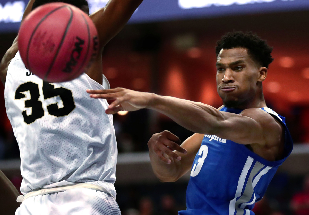 <strong>University of Memphis guard Jeremiah Martin (3) passes the ball to a teammate during an AAC tournament game against UCF on Friday, March 15, 2019, at FedExForum in Memphis.</strong> (Houston Cofield/Daily Memphian)