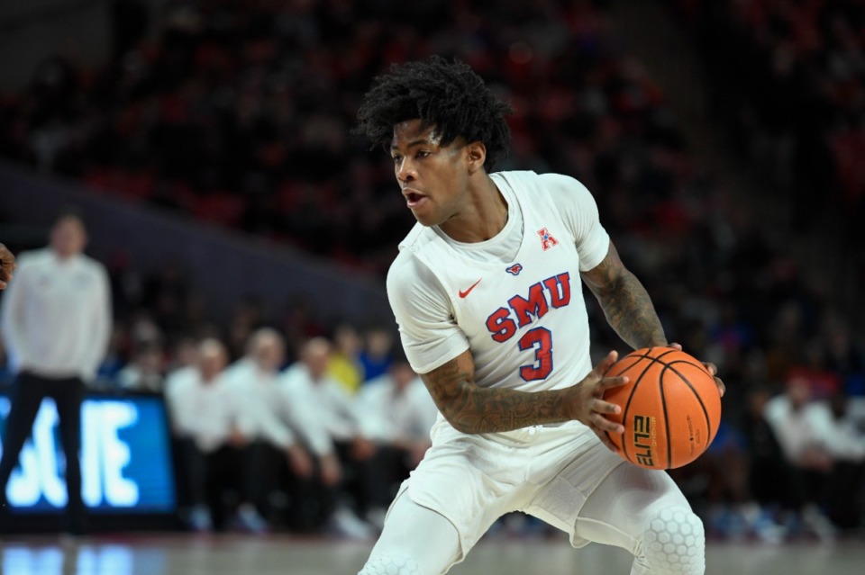 <strong>SMU guard Kendric Davis (3) controls the ball against Houston during the first half of an NCAA college basketball game Sunday, Feb. 27, 2022, in Houston.</strong> (AP Photo/Justin Rex)