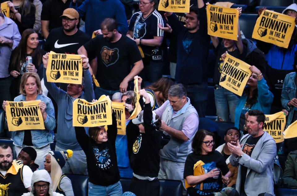 <strong>Fans cheer the Memphis Grizzlies with the&nbsp;&ldquo;No Runnin&rsquo; in the M&rdquo; Growl Towels&nbsp;during Game 2 of the playoff series against the Minnesota Timberwolves on April 19 at FedExForum.</strong> (Patrick Lantrip/Daily Memphian)