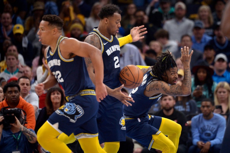 <strong>Memphis Grizzlies guard Desmond Bane (22), center Xavier Tillman (2), and guard Ja Morant (12) put on a show in Game 2 of the first-round NBA basketball playoff series against the Minnesota Timberwolves on April 19, 2022, at FedExForum.</strong> (Brandon Dill/AP)