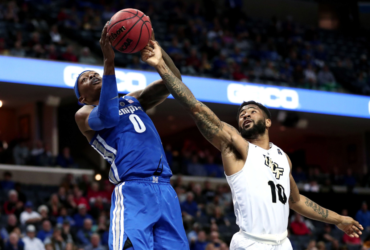 <span class="s1"><strong>University of Memphis forward Kyvon Davenport (0) pulls a rebound away from University of Central Florida guard Dayon Griffin (10) during an AAC tournament game against UCF on Friday, March 15, 2019, at FedExForum in Memphis. </strong>(Houston Cofield/Daily Memphian)</span>