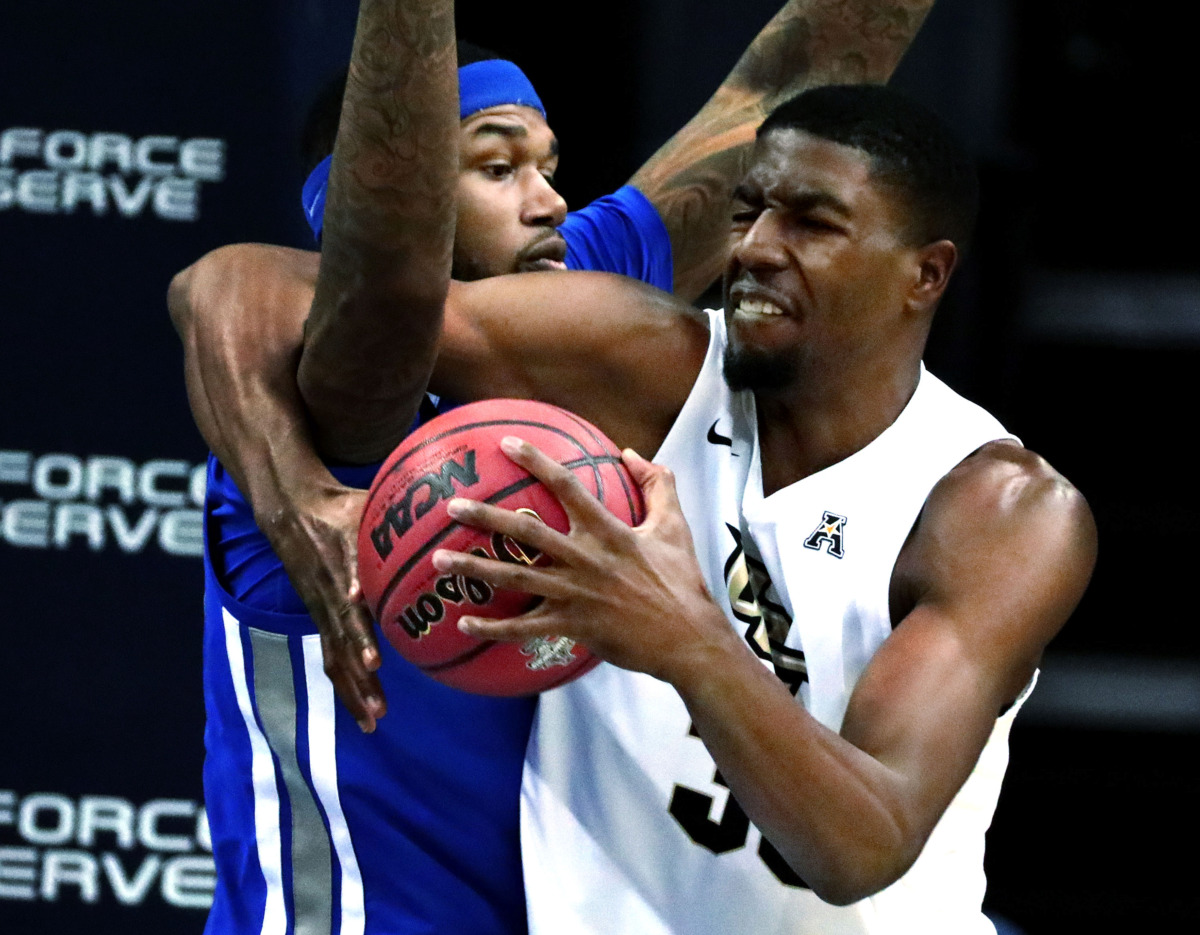 <strong>University of Central Florida forward Collin Smith (35) struggles for a rebound against University of Memphis forward Mike Parks Jr. (10)&nbsp;</strong><span class="s1"><strong>during an AAC tournament game against UCF on Friday, March 15, 2019, at FedExForum in Memphis. </strong>(Houston Cofield/Daily Memphian)</span>