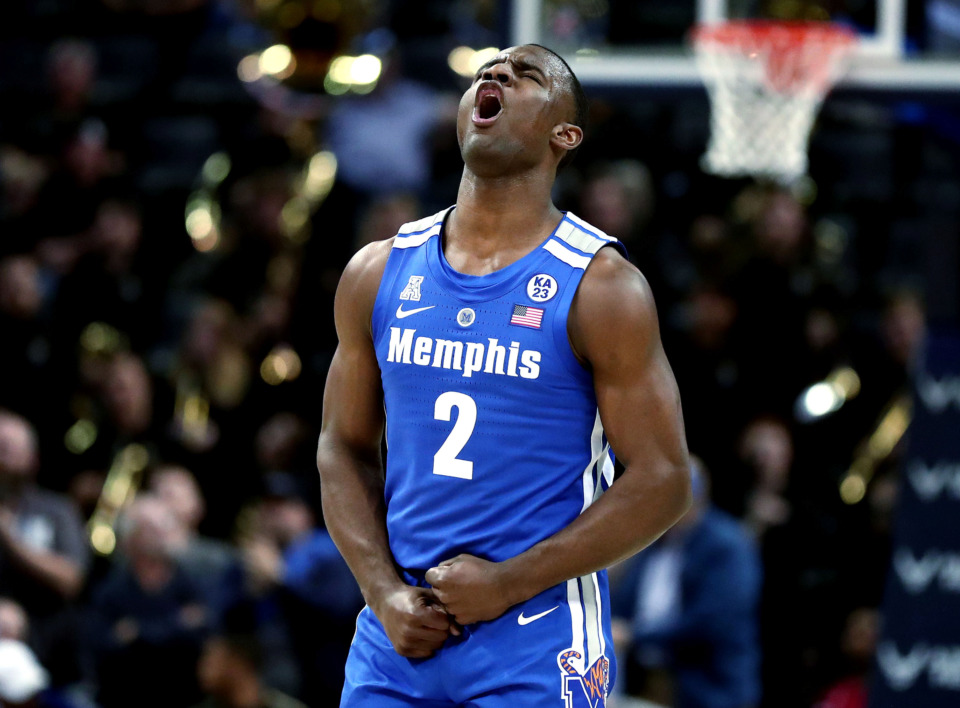 <strong>University of Memphis guard Alex Lomax (2) celebrates after the Tigers take down the University of Central Florida Knights in the quarterfinals of the American Athletic Conference tournament. The Tigers had a big win over the Knights, 79-55, to move on to play Houston on Saturday, Mar. 16.</strong> (Houston Cofield/Daily Memphian)