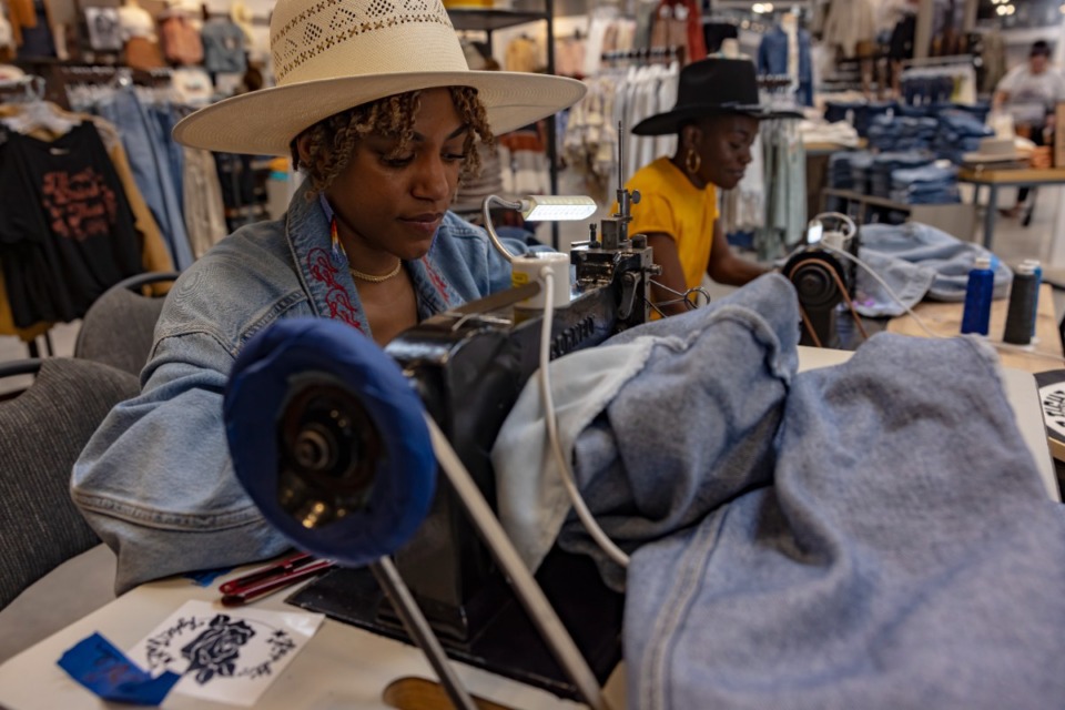 <strong>Whitney Washington (left) and Ashley Padmore of We Tight Knit worked during a pop-up shop at the Boot Barn&rsquo;s grand opening at Southwind on April 10, 2022.</strong> (Ziggy Mack/Special to The Daily Memphian)