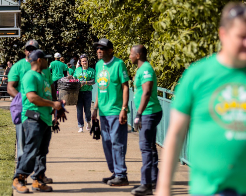 <strong>A few dozen Valero volunteers gathered in Vance Park along the river bluff to plant trees on the steep hill overlooking the river.</strong> (Houston Cofield/Special To The Daily Memphian)
