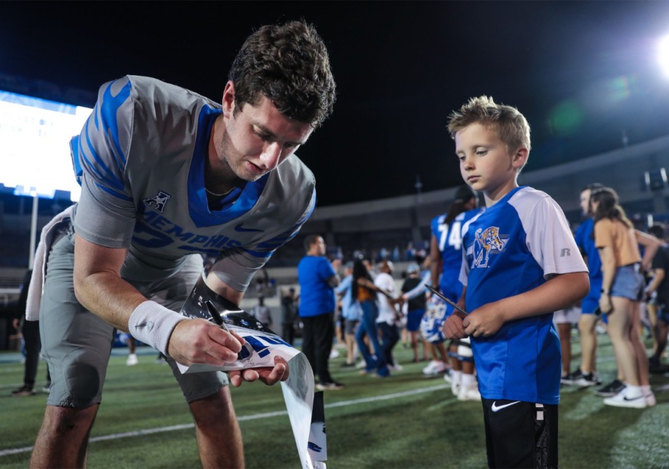 <strong>University of Memphis quarterback Hunter Hulsey (23) signs autographs after the Tigers&rsquo; spring game on April 22, 2022.</strong> (Patrick Lantrip/Daily Memphian)