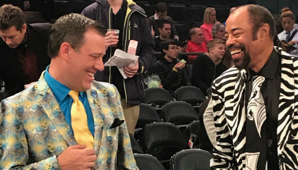 <strong>Because of his wacky style, Rob Fischer (left, with New York Knicks broadcaster Walt &lsquo;Clyde&rsquo; Frazier at a Grizzlies-Knicks game) has fans in NBA arenas across the league who look forward to seeing what he will wear. His favorite place to go is New York because&nbsp; Frazier wears suits in a similar style. </strong>(Courtesy Rob Fischer)