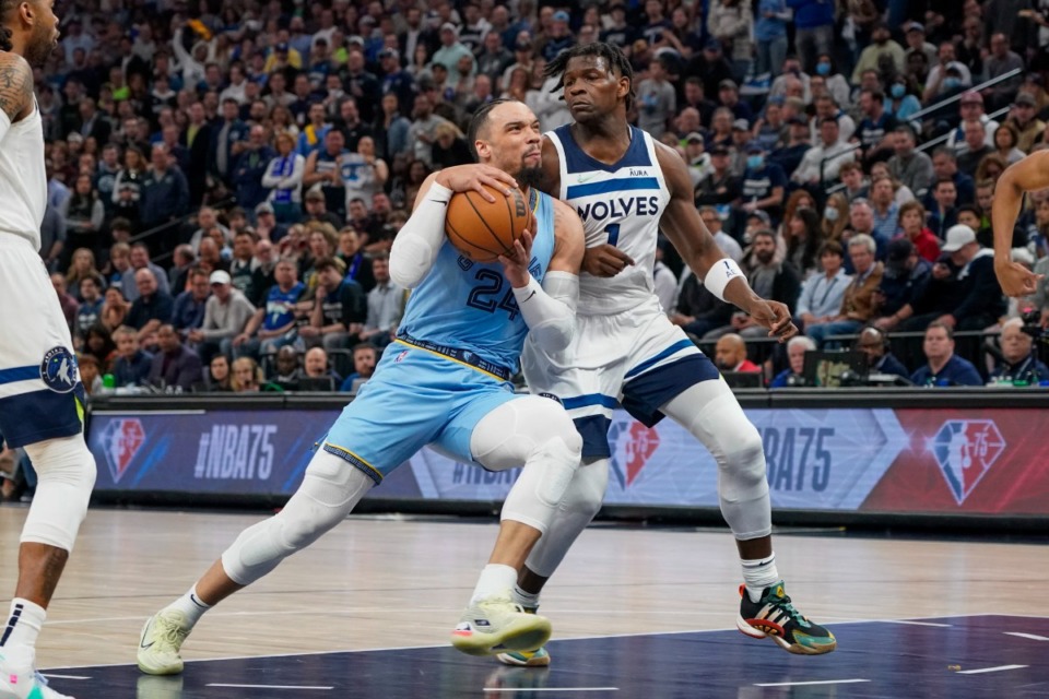 <strong>Memphis Grizzlies guard Dillon Brooks, left, drives past Minnesota Timberwolves guard Anthony Edwards during the first half in Game 4 of an NBA basketball first-round playoff series Saturday, April 23, 2022, in Minneapolis.</strong> (AP Photo/Craig Lassig)