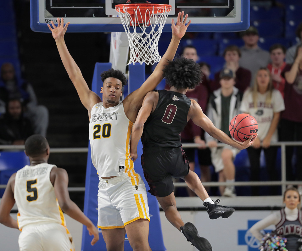 <strong>Bearden's Jacques Glover shoots under pressure by Whitehaven's Jordan Wilmore during Whitehaven's TSSAA Class AAA semifinal game against Bearden at MTSU in Murfreesboro on March 15, 2019.</strong> (Jim Weber/Daily Memphian)