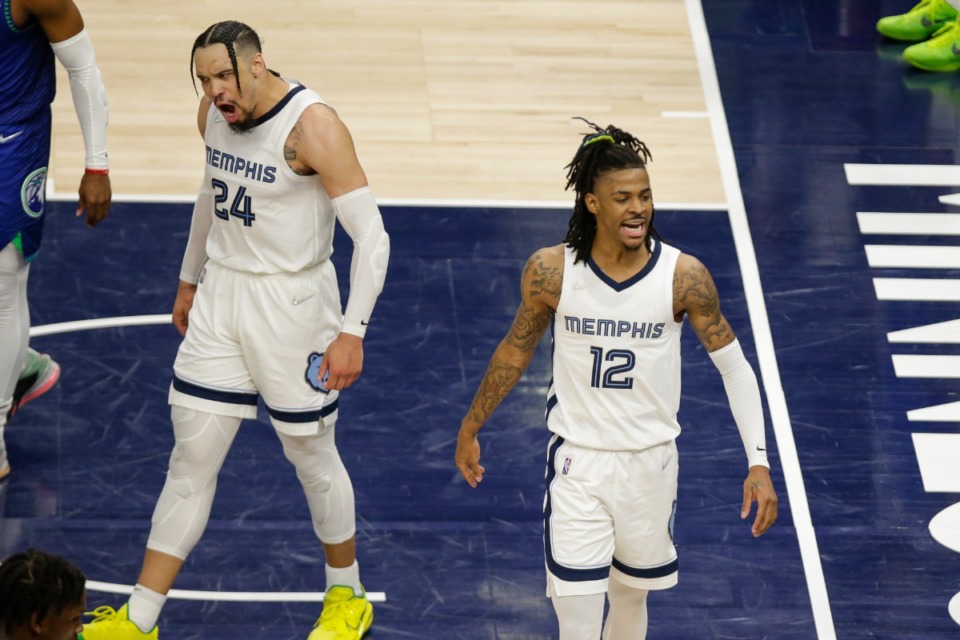 <strong>Memphis Grizzlies forward Dillon Brooks (24) and Grizzlies guard Ja Morant (12) celebrate during Game 3 of an NBA basketball first-round playoff series against the Minnesota Timberwolves Thursday, April 21, 2022, in Minneapolis.&nbsp;But Saturday night&rsquo;s game was less joyous.</strong> (AP Photo/Andy Clayton-King)