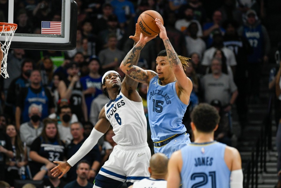 Memphis Grizzlies forward Brandon Clarke (15) passes the ball as Minnesota Timberwolves forward Jarred <strong>Vanderbilt (8) defends during the second half of Game 4 of an NBA basketball first-round playoff series Saturday, April 23, 2022, in Minneapolis. The Timberwolves won 119-118.</strong> (AP Photo/Craig Lassig)