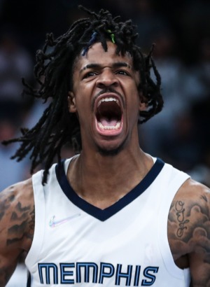 <strong>Memphis Grizzlies guard Ja Morant (12) celebrates a dunk on April 16.</strong> (Patrick Lantrip/Daily Memphian file)