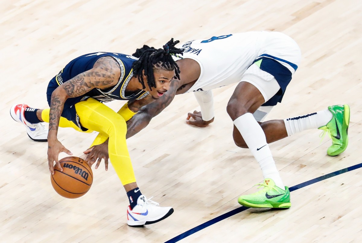 <strong>Memphis Grizzlies guard Ja Morant (left) grabs a loose ball from Minnesota&rsquo;s&nbsp; Jarred Vanderbilt (left) on Tuesday, April 26, 2022, at FedExForum.</strong> (Mark Weber/The Daily Memphian)