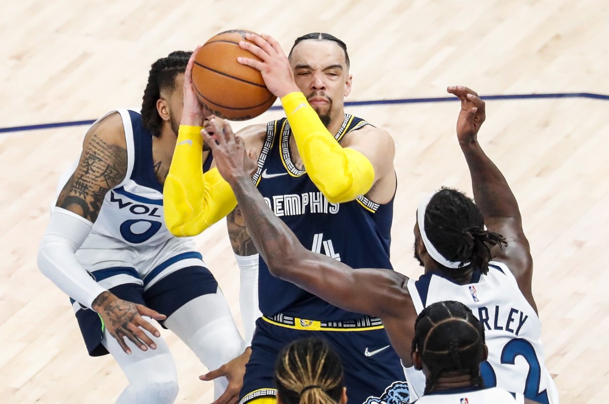 <strong>Memphis Grizzlies guard Dillon Brooks (middle) drives the lane against Minnesota&nbsp;on Tuesday, April 26, 2022, at FedExForum.</strong> (Mark Weber/The Daily Memphian)