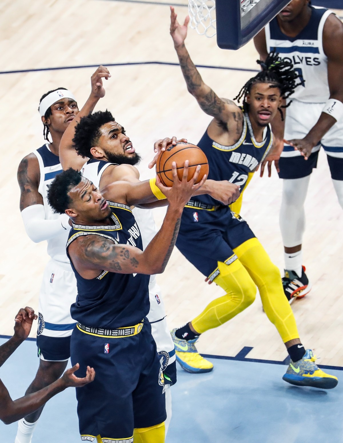 <strong>Memphis Grizzlies forward Xavier Tillman Sr. (bottom) grabs a rebound from Minnesota Timberwolves center Karl-Anthony Towns (middle)&nbsp;on Tuesday, April 26, 2022, at FedExForum.</strong> (Mark Weber/The Daily Memphian)