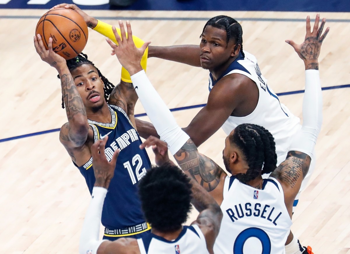 <strong>Memphis Grizzlies guard Ja Morant (left) drives the lane against Minnesota</strong>&nbsp;<strong>on Tuesday, April 26, 2022, at FedExForum.</strong> (Mark Weber/The Daily Memphian)