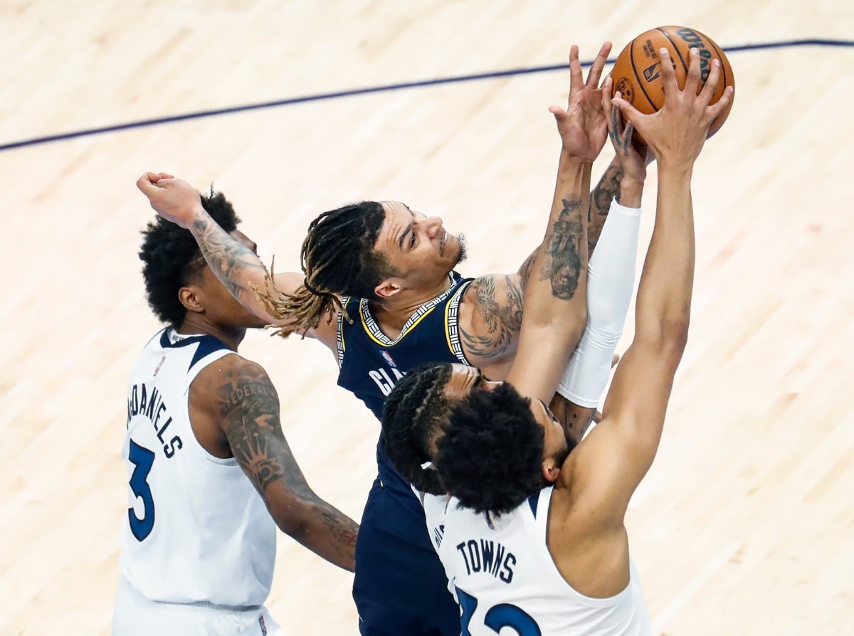 <strong>Memphis Grizzlies forward Brandon Clarke (middle) fights for a rebound against Minnesota&nbsp;on Tuesday, April 26, 2022, at FedExForum.</strong> (Mark Weber/The Daily Memphian)