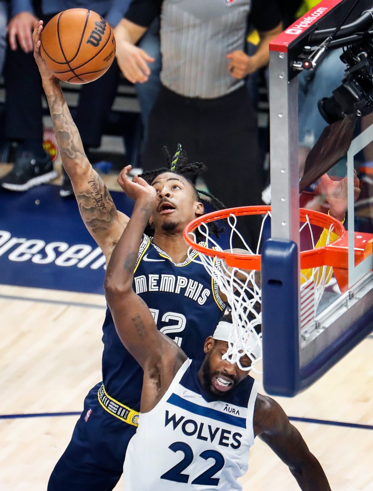 <strong>Memphis Grizzlies guard Ja Morant (top) grabs a rebound against Minnesota&rsquo;s Patrick Beverley (bottom)&nbsp;on Tuesday, April 26, 2022, at FedExForum.</strong> (Mark Weber/The Daily Memphian)