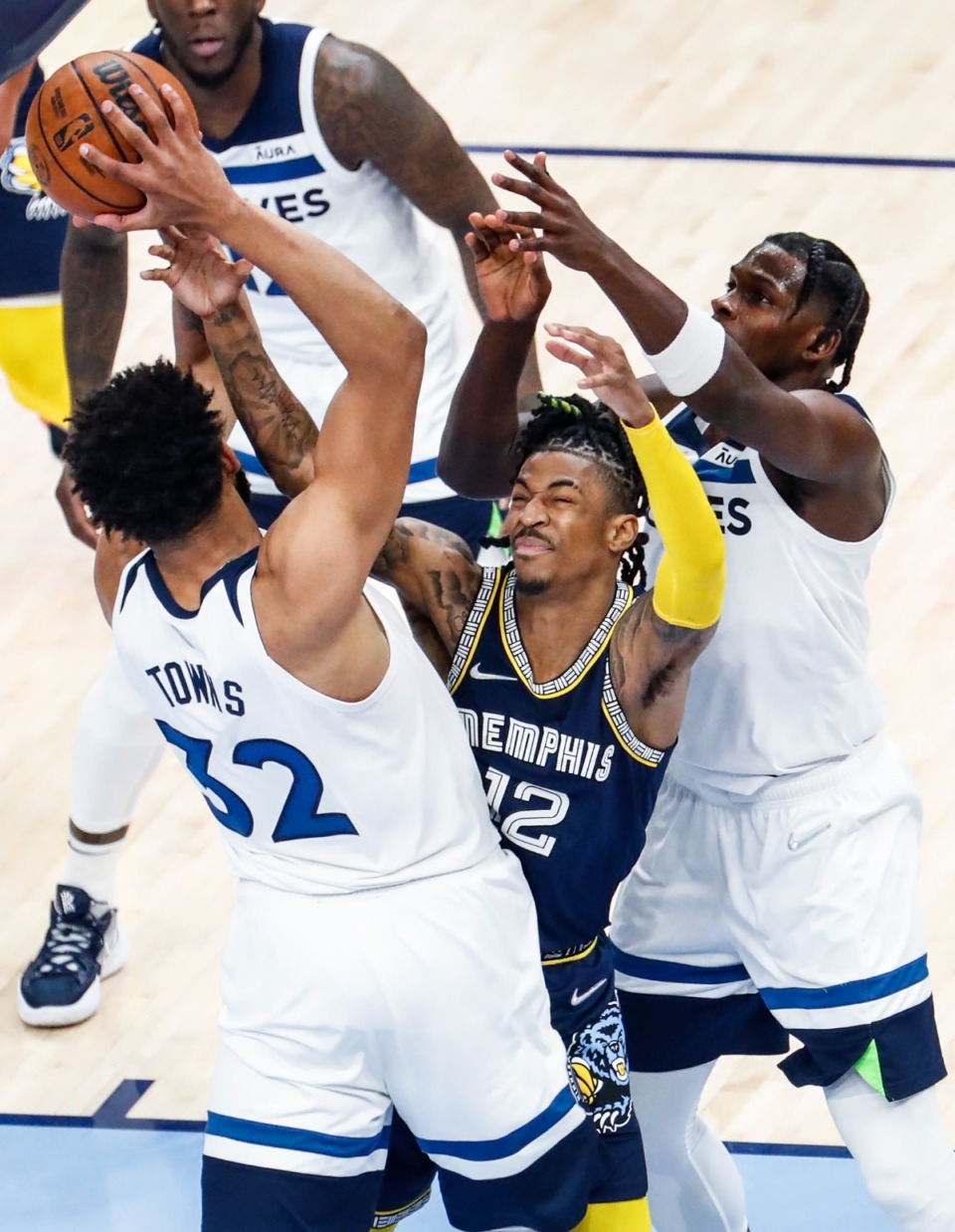 <strong>Memphis Grizzlies guard Ja Morant (middle) fights for a rebound against Minnesota&rsquo;s Karl-Anthony Towns (left) and Anthony Edwards (right)&nbsp;on Tuesday, April 26, 2022, at FedExForum.</strong> (Mark Weber/The Daily Memphian)