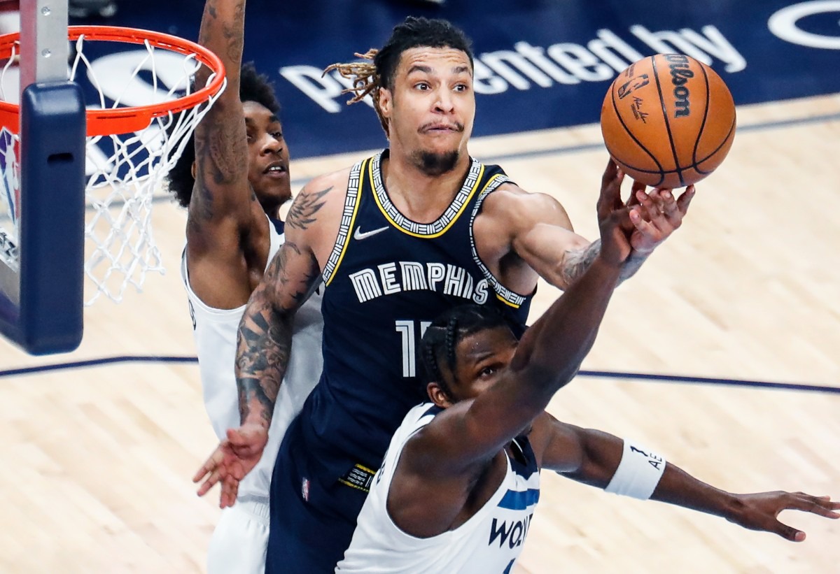 <strong>Memphis Grizzlies forward Brandon Clarke (middle) battles for a rebound against Minnesota on Tuesday, April 26, 2022.</strong> (Mark Weber/The Daily Memphian)