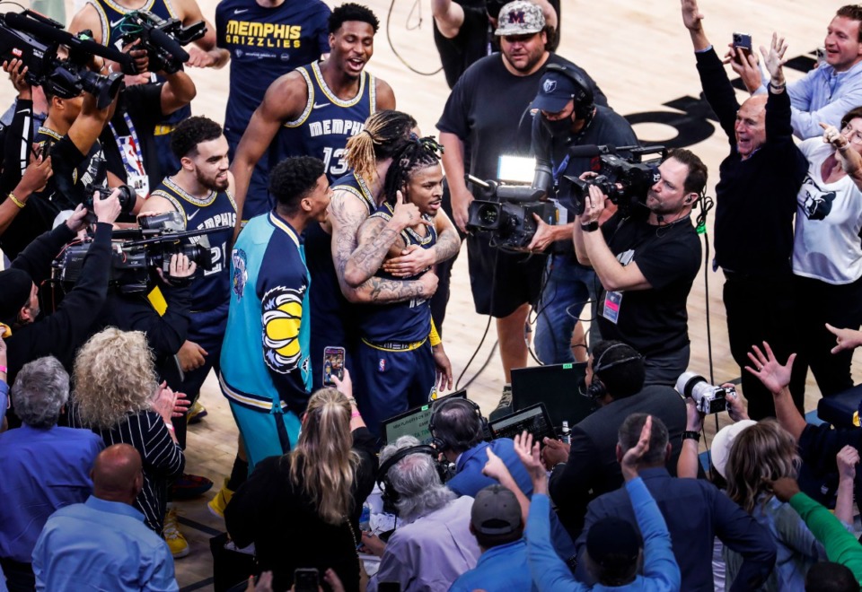 <strong>Grizzlies guard Ja Morant (middle) celebrates with his teammates and fans after Memphis beats Minnesota in Game 5 of the first round of the NBA playoffs on April 26, 2022.</strong> (Mark Weber/The Daily Memphian)