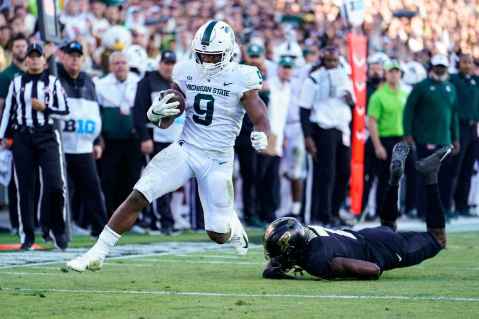 <strong>Michigan State running back Kenneth Walker III (9), seen here last December,&nbsp;was the second running back selected in the 2022 NFL draft on Friday.</strong> (AP file)