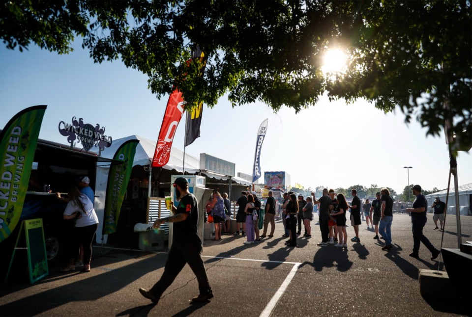 <strong>Fans line up for libations during the first day of the Beale Street Music Festival on Friday, April 29, at Liberty Park.</strong> (Mark Weber/The Daily Memphian)