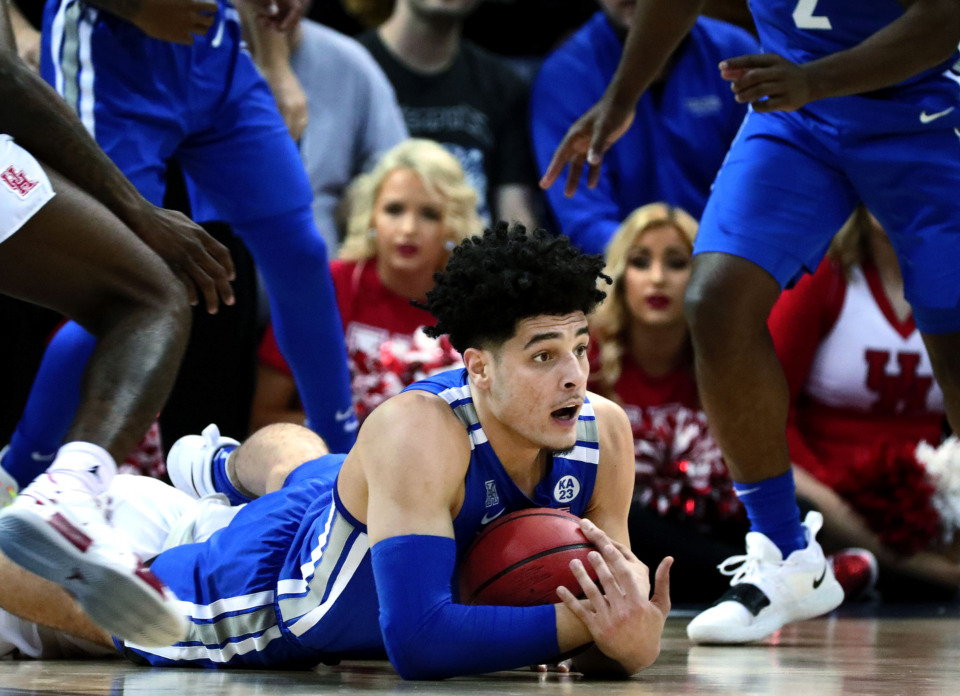 <strong>University of Memphis forward Isaiah Maurice (14) dives to save possession&nbsp;</strong><span class="s1"><strong>during a semifinal game&nbsp;against Houston in the American Athletic Conference tournament on Saturday, March 16, 2019. </strong>(Houston Cofield/Daily Memphian)</span>