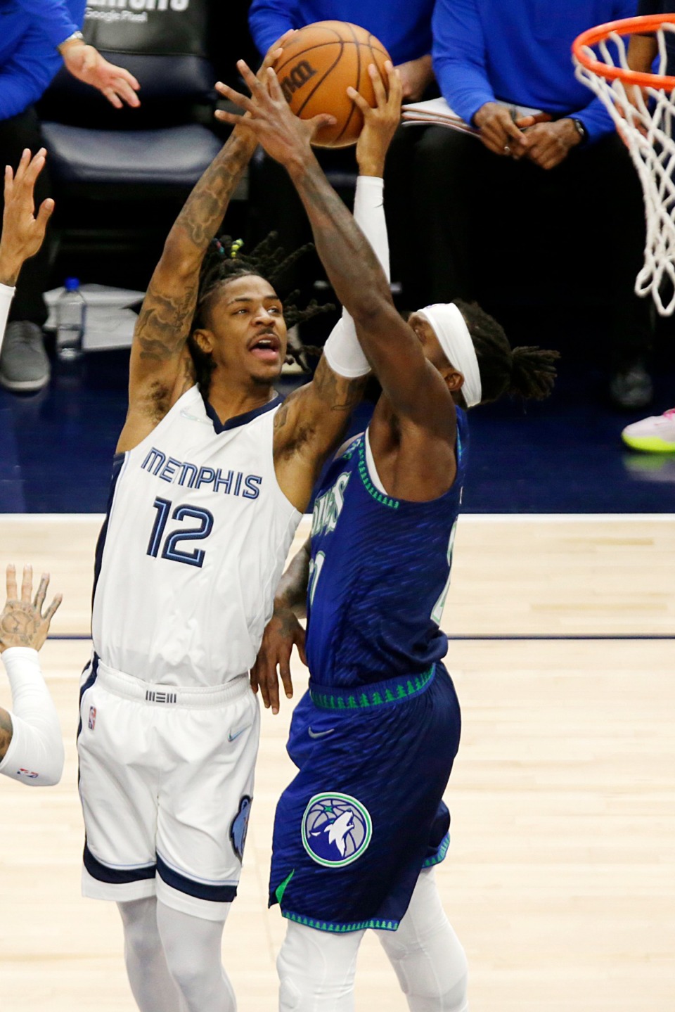 <strong>Memphis Grizzlies guard Ja Morant (12) shoots against Minnesota guard Patrick Beverley (22) ion April 29, 2022, in Minneapolis.</strong> (Andy Clayton-King/AP)