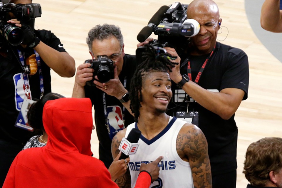 <strong>Memphis Grizzlies guard Ja Morant smiles as he is interviewed after the Grizzlies defeat the Minnesota Timberwolves on April 29, 2022, in Minneapolis.</strong> (Andy Clayton-King/AP)