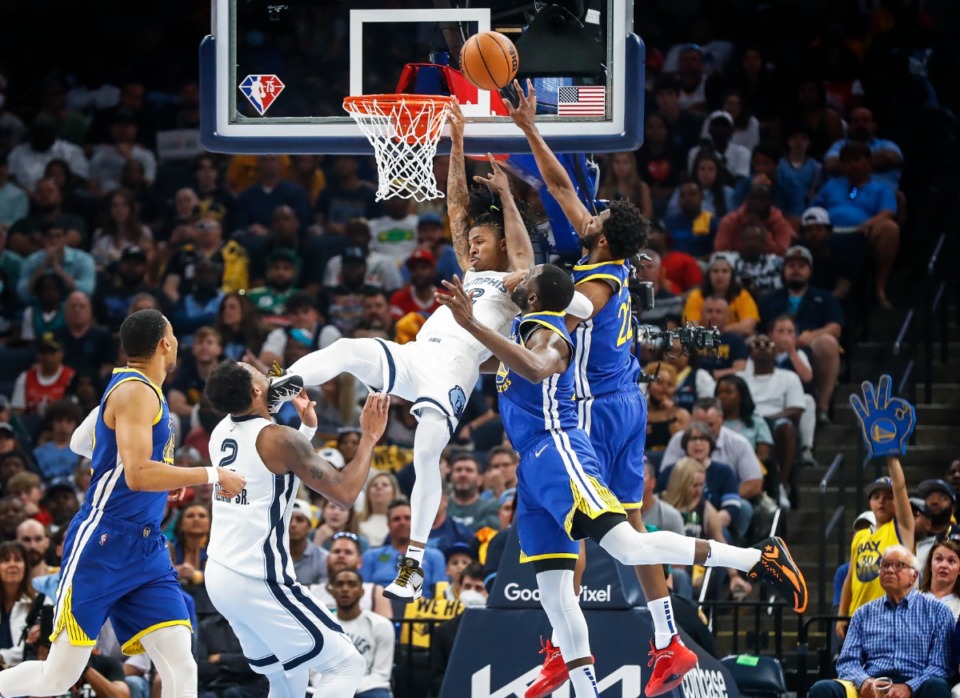 <strong>Memphis Grizzlies&rsquo; Ja Morant (middle) defends against a Golden State Warriors guard&rsquo;s Andrew Wiggins (right) shot on Sunday, May 1, 2022.</strong> (Mark Weber/The Daily Memphian)
