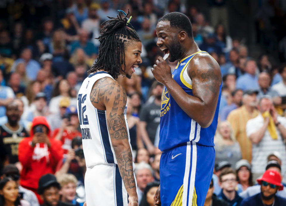 <strong>Memphis Grizzlies guard Ja Morant (left) starts jawing with Golden State Warriors defender Draymond Green (right) on Sunday, May 1, 2022.</strong> (Mark Weber/The Daily Memphian)