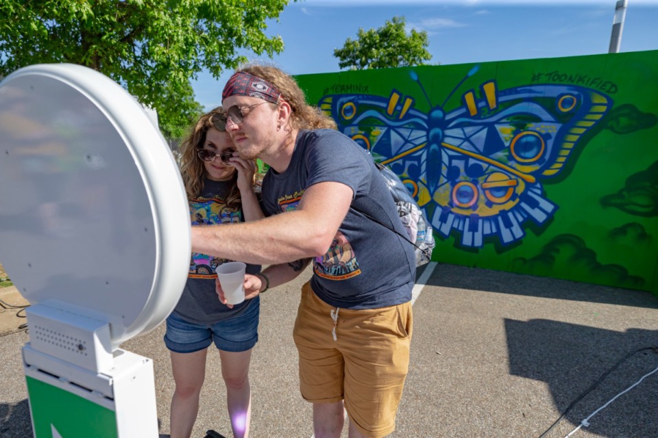 <strong>Sara Parker and Tanner South take a selfie in front of a mural at Beale Street Music Festival at the Fairgrounds on Sunday May 1, 2022.</strong> (Ziggy Mack/Special to The Daily Memphian)